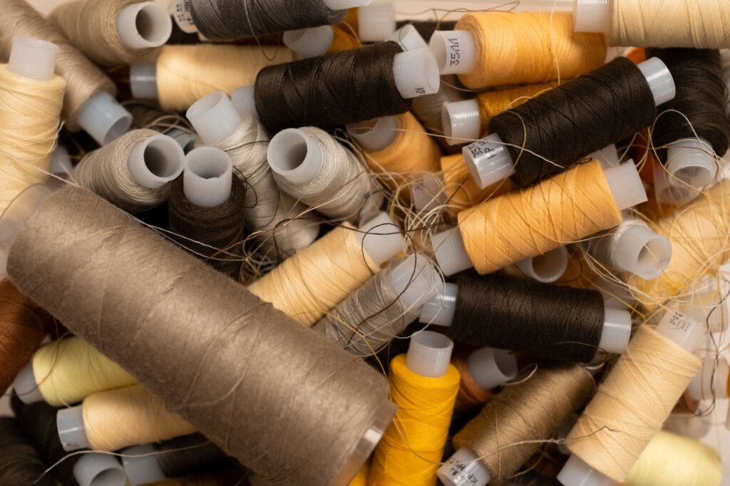 A vibrant collection of threads showcasing a range of colors for sewing and crafting projects.
