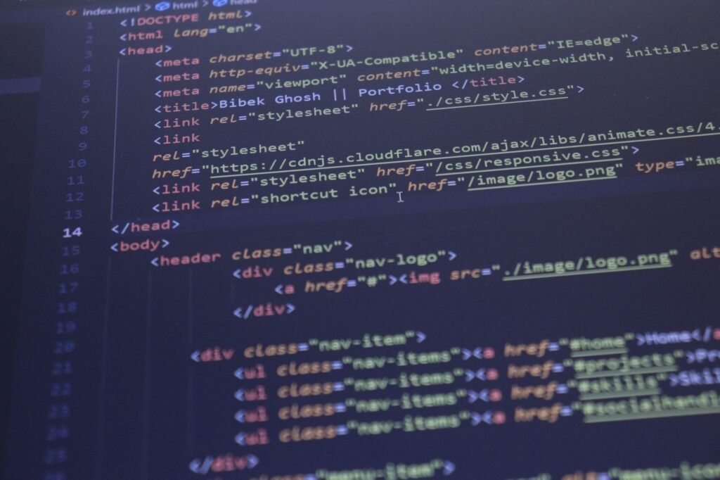 Close-up view of HTML and CSS code displayed on a computer screen, ideal for programming and technology themes.