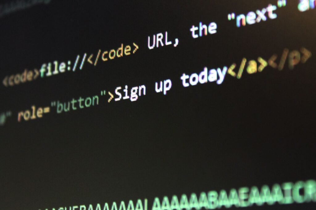 Detailed view of HTML and CSS code on a computer screen, concept of programming.