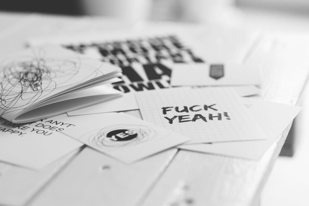 Black and white motivational typography art with bold messages.